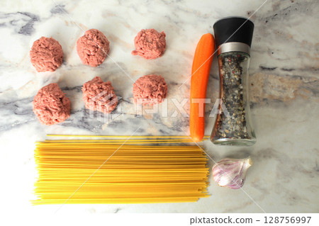 Concept of the recipe for cooking meatballs with spaghetti pasta view from above 128756997