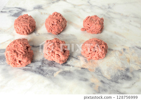 meatballs, meat balls lying on a light background, close-up. Cooking meatballs meatballs, meat balls lying on a light background, close-up. Cooking meatballs 128756999