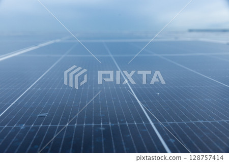 Solar cell photovoltaic panels technology for renewable energy solution on roof. Electrical energy obtained from nature sunlight clean renewable energy. 128757414