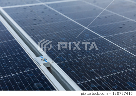 Solar cell photovoltaic panels technology for renewable energy solution on roof. Electrical energy obtained from nature sunlight clean renewable energy. Solar cell photovoltaic panels technology for renewable energy solution on roof. Electrical energy obtained from nature sunlight clean renewable energy. 128757415