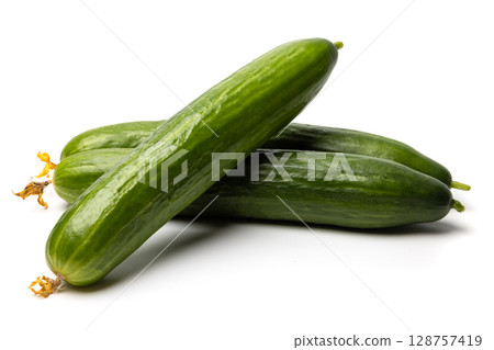 Photo of a small bunch of green natural organic cucumbers isolated on white background Photo of a small bunch of green natural organic cucumbers isolated on white background 128757419