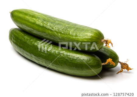 Photo of a small bunch of green natural organic cucumbers isolated on white background 128757420