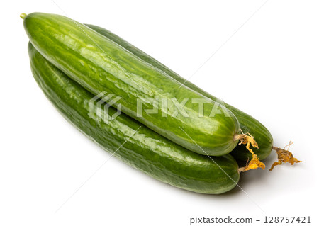 Photo of a small bunch of green natural organic cucumbers isolated on white background Photo of a small bunch of green natural organic cucumbers isolated on white background 128757421