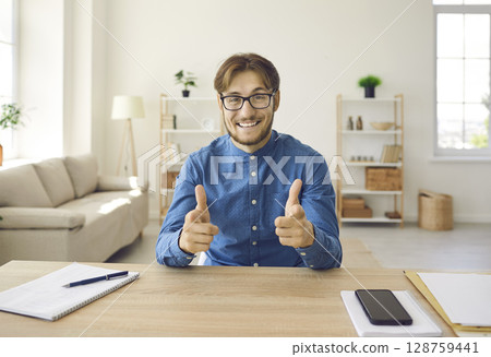 Male consultant who persuades client to accept good offer by talking on video call. Male consultant who persuades client to accept good offer by talking on video call. 128759441