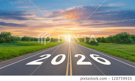 Sunrise over a winding road leading to a bright future in 2026, showcasing vibrant skies and lush green landscapes 128759910