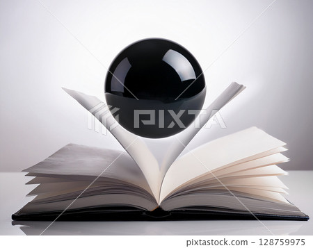 一個黑色球體漂浮在一本打開的書上方 一個黑色球體漂浮在一本打開的書上方 128759975