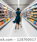 Woman Shopping in Supermarket Aisle with Grocery Cart 128760017