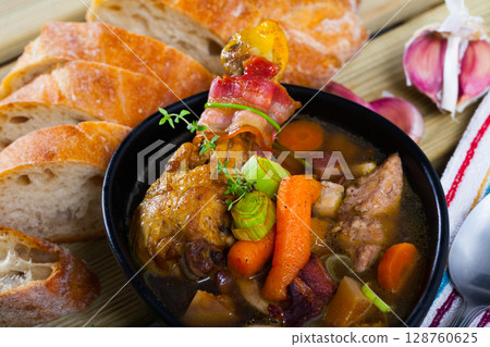 Tasty scottish traditional soup cock-a-leekie with chicken, bacon and leek Tasty scottish traditional soup cock-a-leekie with chicken, bacon and leek 128760625