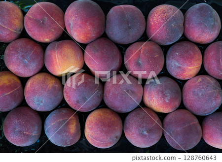 Ripe peaches in box Ripe peaches in box 128760643