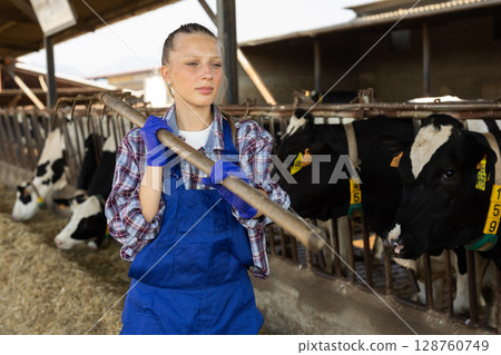 Portrait of young girl farm employee Portrait of young girl farm employee 128760749