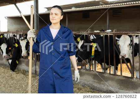 Asian woman farmer with pitchforks on farm Asian woman farmer with pitchforks on farm 128760822