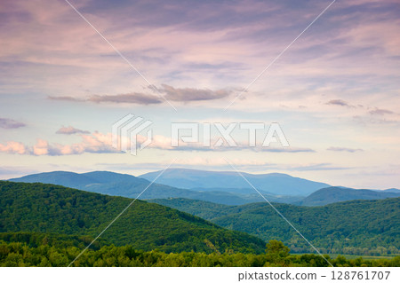 mountain landscape under evening sky with dramatic clouds. beautiful carpathian countryside scenery in summer. picturesque view 128761707