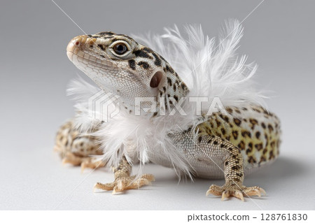 Fashionable lizard adorned with fluffy feathers showcasing unique style and playful personality 128761830