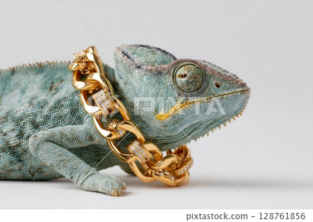 Fashionable chameleon adorned with a luxurious gold chain showcasing unique style and personality 128761856