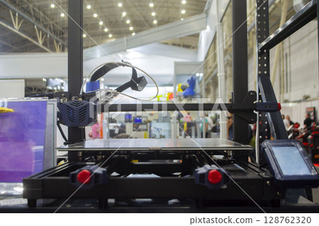 3D printer. Working surface desktop of 3D printer. Empty work surface of non-working 3D printer. Print head printer. Additive progressive technology. Modern new printing industry 3D printer. Working surface desktop of 3D printer. Empty work surface of non-working 3D printer. Print head printer. Additive progressive technology. Modern new printing industry 128762320