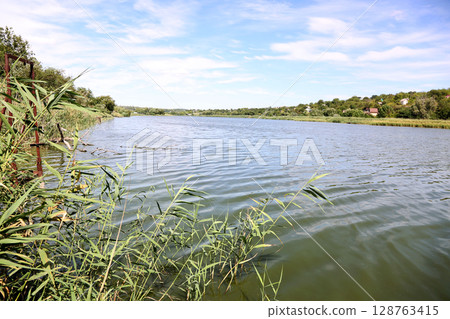 Landscape with a river outside the city 128763415