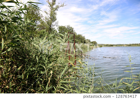 Landscape with a river outside the city Landscape with a river outside the city 128763417
