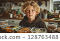 Portrait of a Blonde Curly Haired Boy with Blue Eyes Preparing His School Lunch 128763488