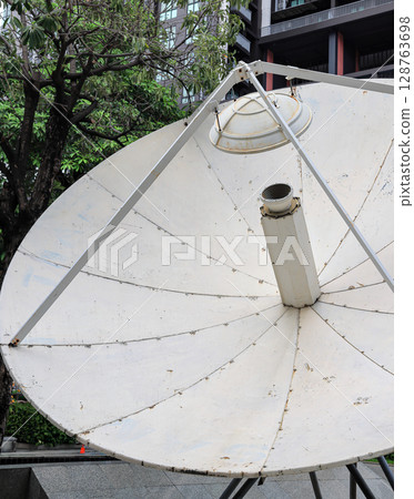 Close up detail of telecommunication satellite dish. 128763698