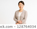 Portrait of a female professor in her 40s (white background, gentle impression) 128764034