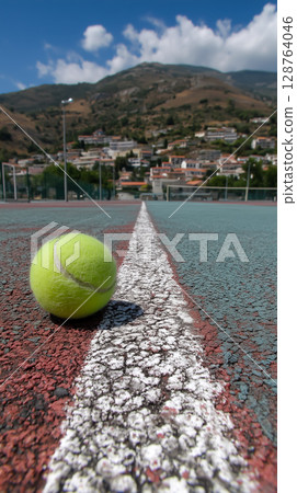 Just within the white line! The decisive moment of a tennis ball bouncing on a clay court 128764046