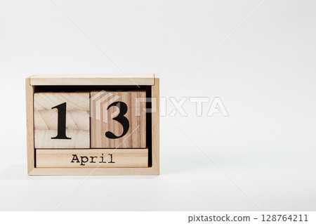 Wooden calendar April 13 on a white background 128764211