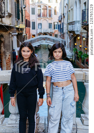 two children standing in Venice posing for photo two children standing in Venice posing for photo 128765129