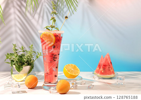 Cold homemade lemonade, sangria or cocktail with mint, watermelon, apricot, lemon and fruits, recipe for a refreshing summer drink, detox diet and weight loss concept, restaurant menu 128765188