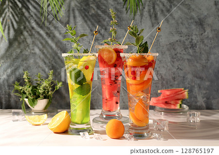 Refreshing summer homemade cocktail, sangria, lemonade with watermelon, apricot, currant, mint and lemon, weight loss concept, healthy and natural nutrition, detox water with fruit flavor 128765197