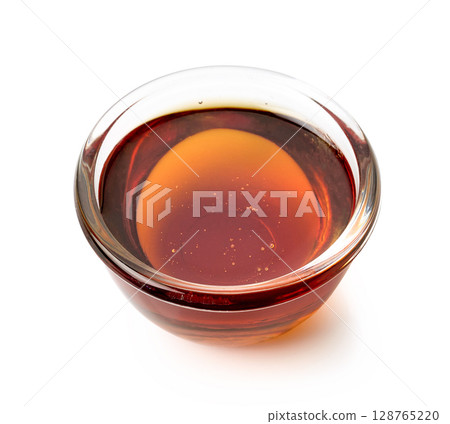 bowl of maple syrup bowl of maple syrup 128765220