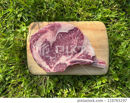 raw bio steak with bone 128765297