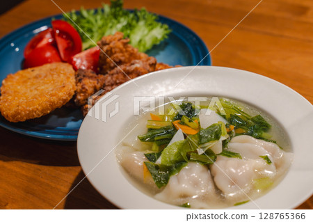 A hearty dinner of fried chicken, boiled dumplings and vegetable soup A hearty dinner of fried chicken, boiled dumplings and vegetable soup 128765366