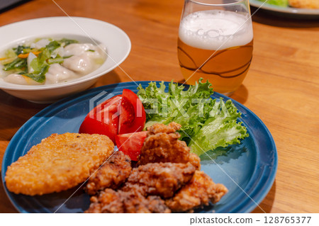A hearty dinner of fried chicken, boiled dumplings and vegetable soup A hearty dinner of fried chicken, boiled dumplings and vegetable soup 128765377
