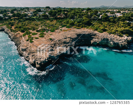 Rocky coastline with turquoise 128765385