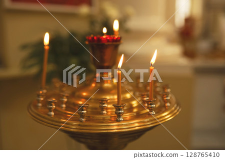 lit candles in church lit candles in church 128765410