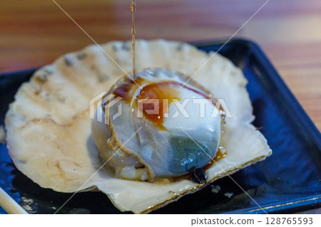 Scallops with soy sauce Scallops with soy sauce 128765593