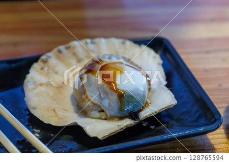 Scallops with soy sauce Scallops with soy sauce 128765594