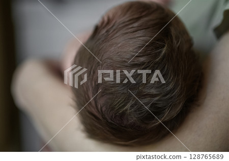 Tender Moment Between Mother and Newborn Baby Tender Moment Between Mother and Newborn Baby 128765689