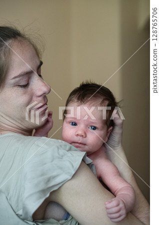 Tender Moment Between Mother and Newborn Baby Tender Moment Between Mother and Newborn Baby 128765706