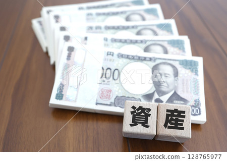 Bills and assets letter blocks, image of financial assets and investment Bills and assets letter blocks, image of financial assets and investment 128765977