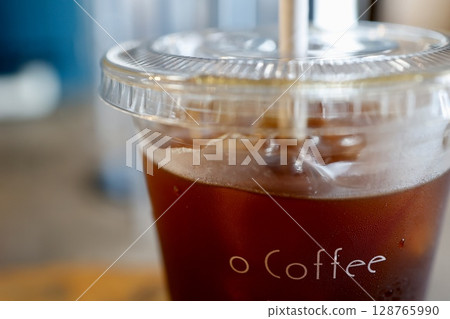 Takeaway iced coffee and cafe atmosphere Takeaway iced coffee and cafe atmosphere 128765990
