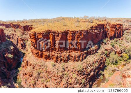 Red rock cliffs and gorge in Karijini National Park, Western Australia.. 128766005