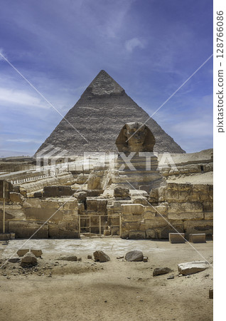 Great Sphinx of Giza, Pyramid of Khafre in the background Great Sphinx of Giza, Pyramid of Khafre in the background 128766086