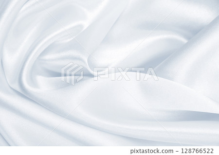 Smooth elegant grey silk or satin luxury cloth as wedding background. Luxurious background design Smooth elegant grey silk or satin luxury cloth as wedding background. Luxurious background design 128766522