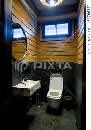 Bathroom with wood trim and modern equipment 128766551