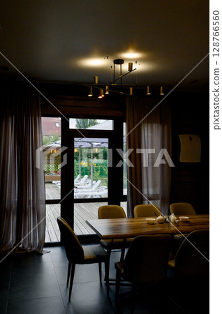 Modern interior of the room with wooden walls and furniture 128766560