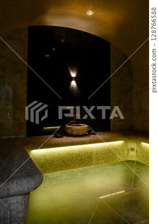 Interior of a hammam sauna with stone finishing and lighting Interior of a hammam sauna with stone finishing and lighting 128766588