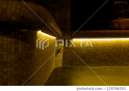 Interior of a hammam sauna with stone finishing and lighting 128766591