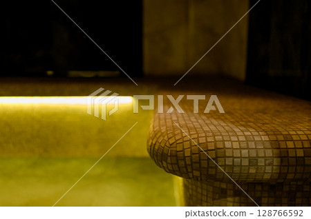 Interior of a hammam sauna with stone finishing and lighting 128766592