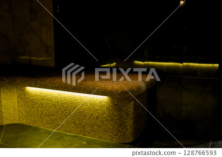 Interior of a hammam sauna with stone finishing and lighting Interior of a hammam sauna with stone finishing and lighting 128766593